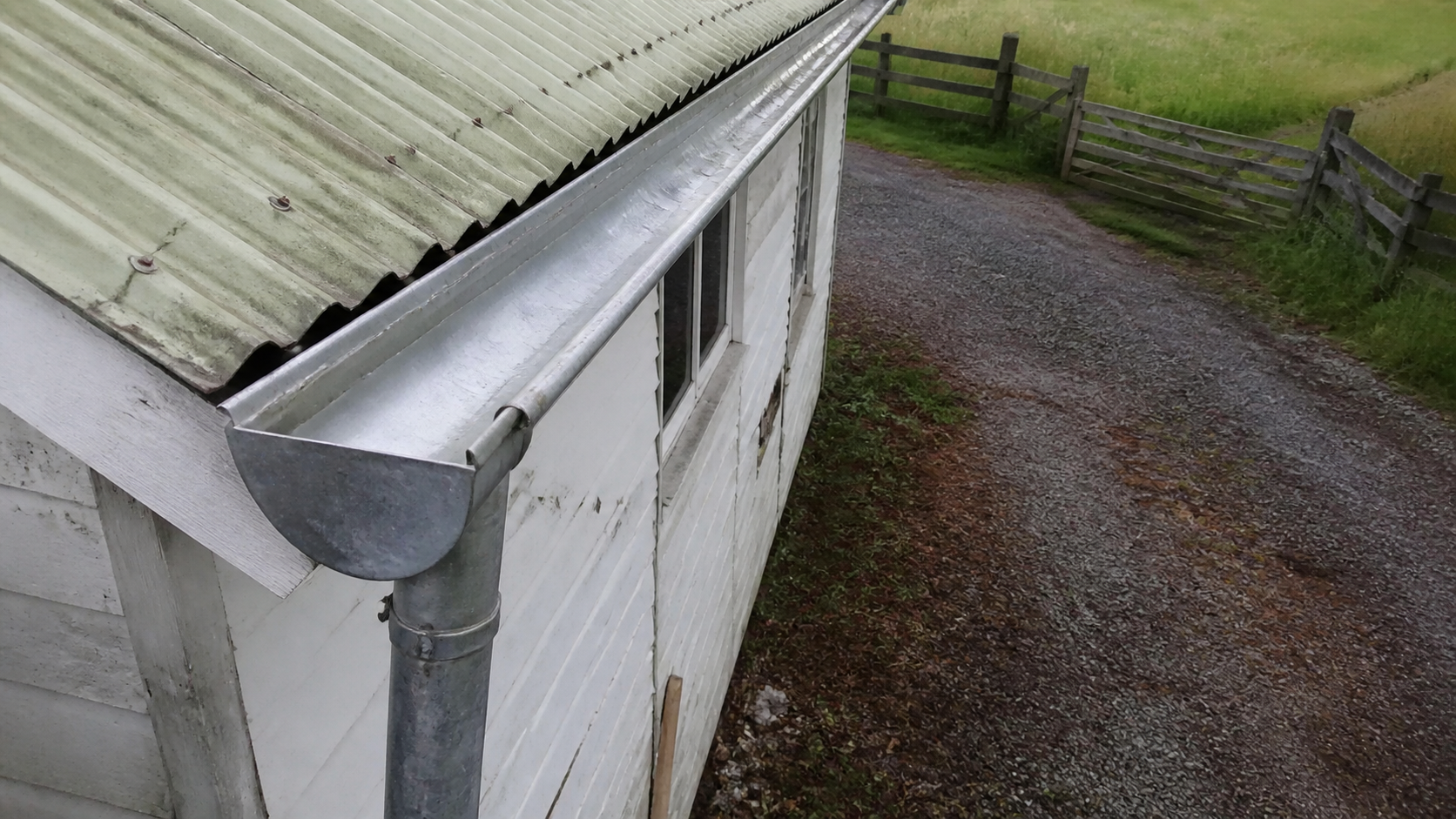 Clean galvanised gutter after flushing on a rural Waikato property